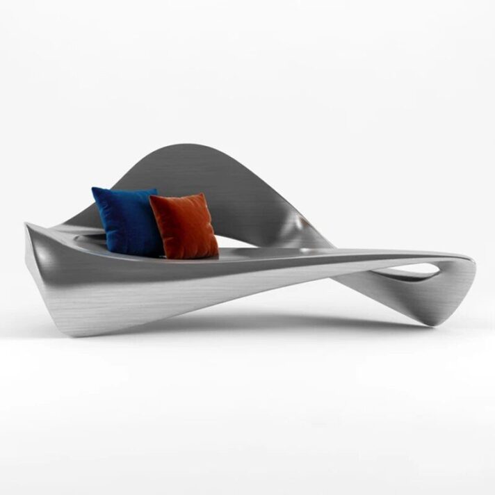 Elegant Nordic-Style Fiberglass Curved Sofa in silver with blue and orange cushions, showcasing a fluid, sculptural form
