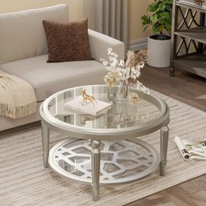Verra Luxe Home 32" round glass coffee table with storage, champagne finish, two-tier design, clear glass top and lower shelf with a decorative pattern