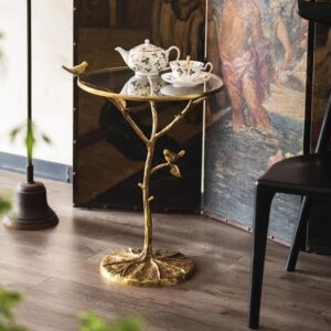 Retro Brass Bird Round Side Table with glass top and brass bird pedestal, a Verra Luxe Home luxury metal and glass coffee table aesthetic featuring a golden-toned, decorative base