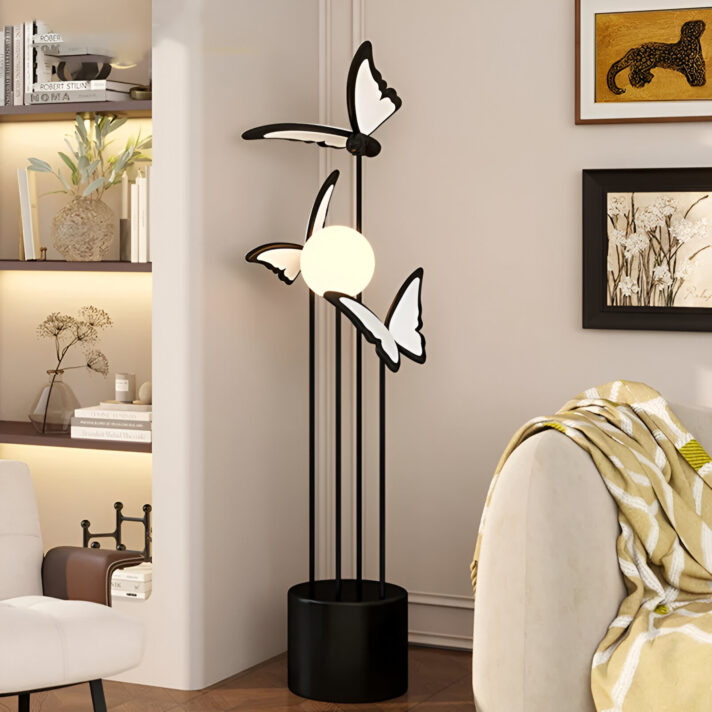 Verra Luxe Home black butterfly-inspired LED floor lamp with white butterfly accents and a white globe, standing in a neutral living room setting.