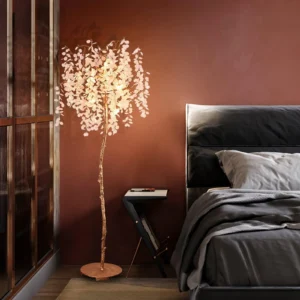 Luxury Crystal Tree Floor Lamp with copper finish and crystal branches, placed beside a dark bed in a warm brown bedroom, matching Verra Luxe Home’s modern decor aesthetic.