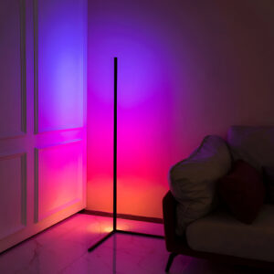 RGB Corner Floor Lamp from Verra Luxe Home emits purple and pink multicolor ambient light in a living room, with a slim black frame beside a sofa