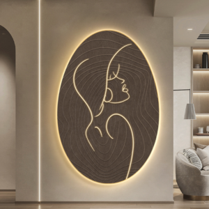 Wabi Sabi LED abstract wall art by Verra Luxe Home: an oval panel with a minimal line drawing of a profile, illuminated by a warm golden LED glow.