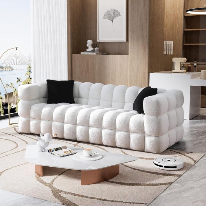 Verra Luxe Home’s 84" Sherpa Boucle Deep Seat Sofa Couch in white with cushy tufted blocks, set in a modern living space with black accent pillows.