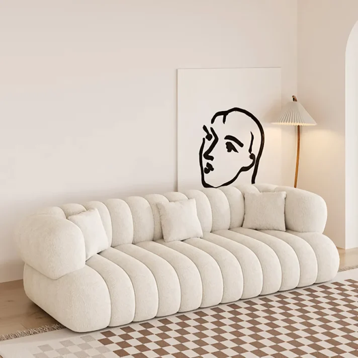 Modern Minimalist Sofa in warm cream plush upholstery by Verra Luxe Home, featuring rounded, segmented cushions for a contemporary living room aesthetic.