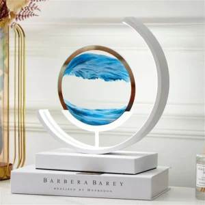 White circular sculpture lamp featuring blue wave art within a ring, a modern lighting piece by Verra Luxe Home with a minimalist base and circular frame.
