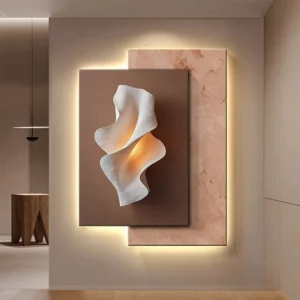Abstract white sculptural wall art with layered curves on brown panel, illuminated by warm backlit frames forming a modern decorative installation