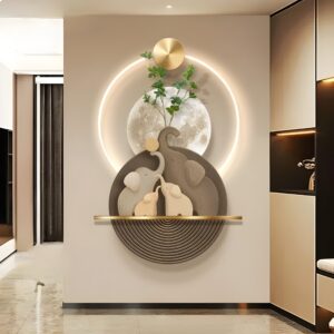 Luminous Elephant Sandstone LED Wall Art featuring layered elephant silhouettes in sandstone tones, a circular backlit halo, and gold accents set against a neutral wall