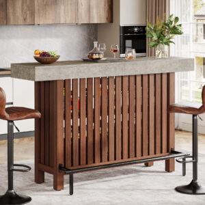 63-Inch Modern Home Bar Unit featuring dark brown vertical slats, concrete top, and two-tier open shelving with a footrest. Paired with brown leather stools and a sleek modern kitchen setting.