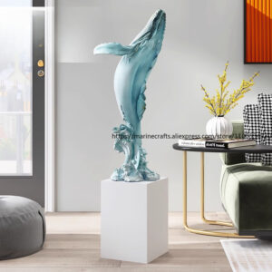 Blue large resin whale sculpture on a white pedestal, modern floor decor by Verra Luxe Home, ocean-inspired art for living spaces