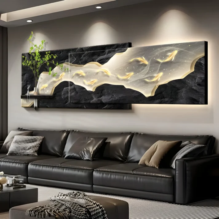 Modern LED Wall Art Light – Luxury Sandstone Decorative Mural features a black textured backdrop with flowing white and gold koi-inspired accents above a black leather sofa