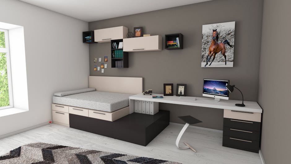 Modern bedroom furniture with a low-profile platform bed, handleless drawers, floating wall shelves, and a grey-and-white minimalist workspace setup.